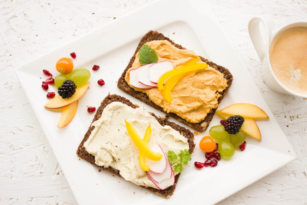 hummus and whole grain toast with fresh fruit for breakfast