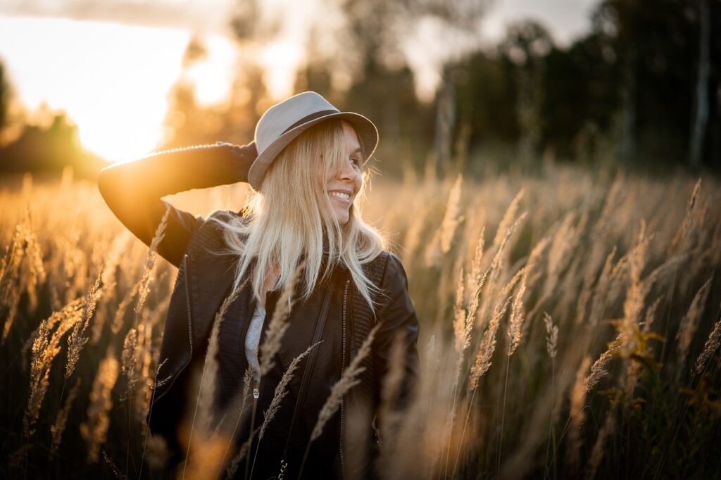 happy woman out in wheat field